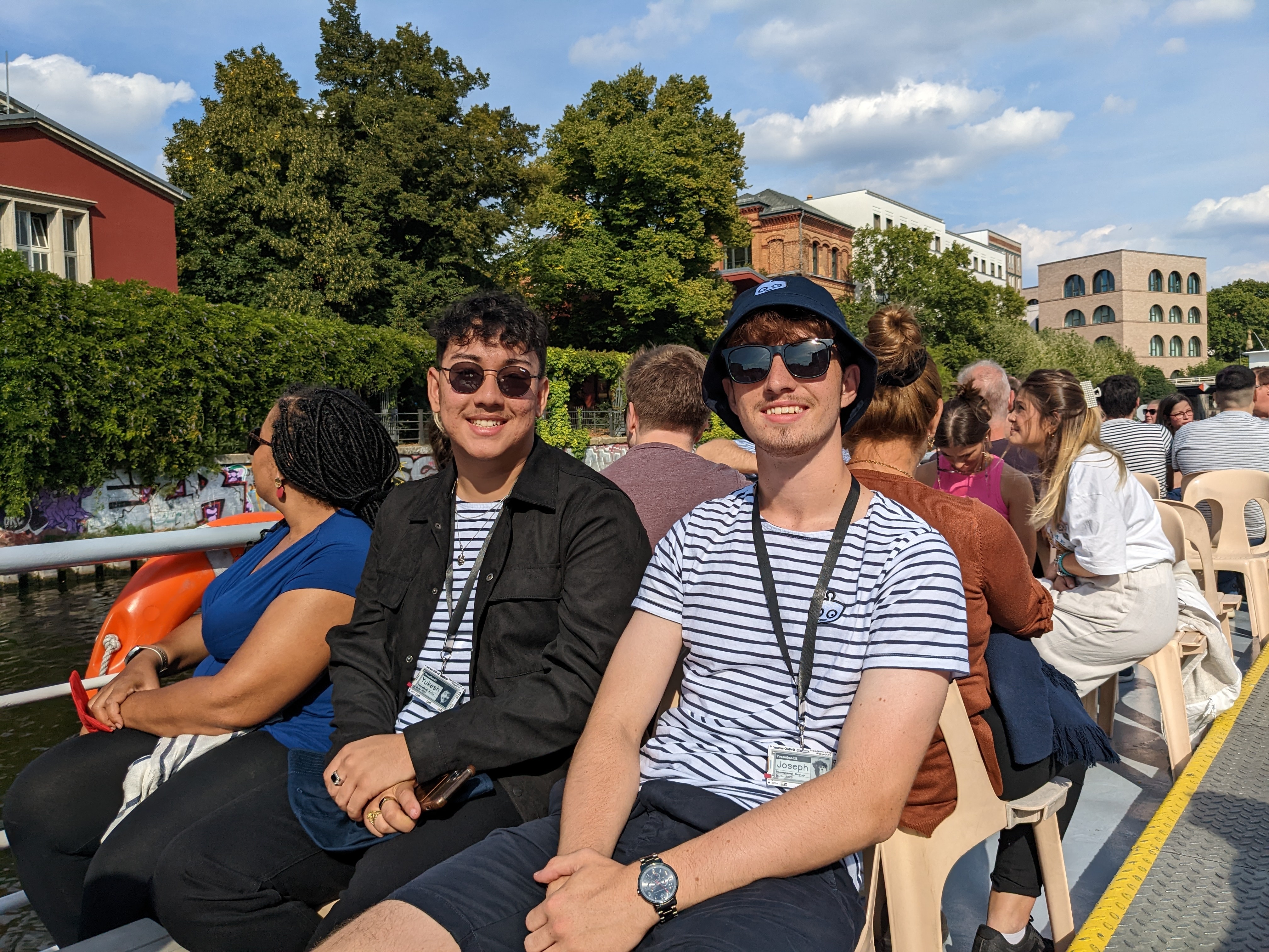 Joseph and Yukesh soaking up some sunshine at the top of the boat